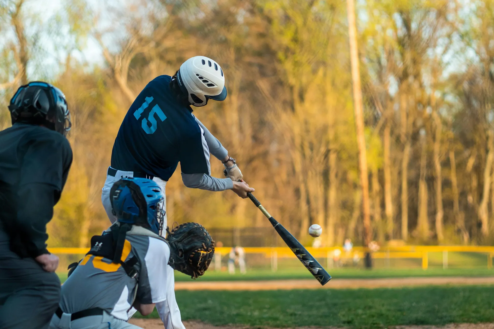 baseball player swinging bat