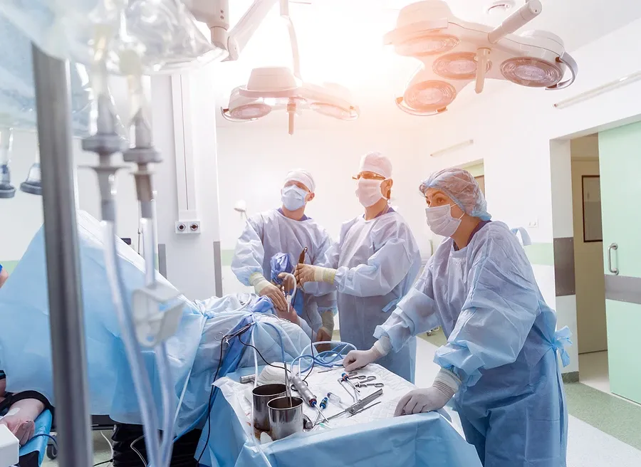 group of orthopedic surgeons performing surgery