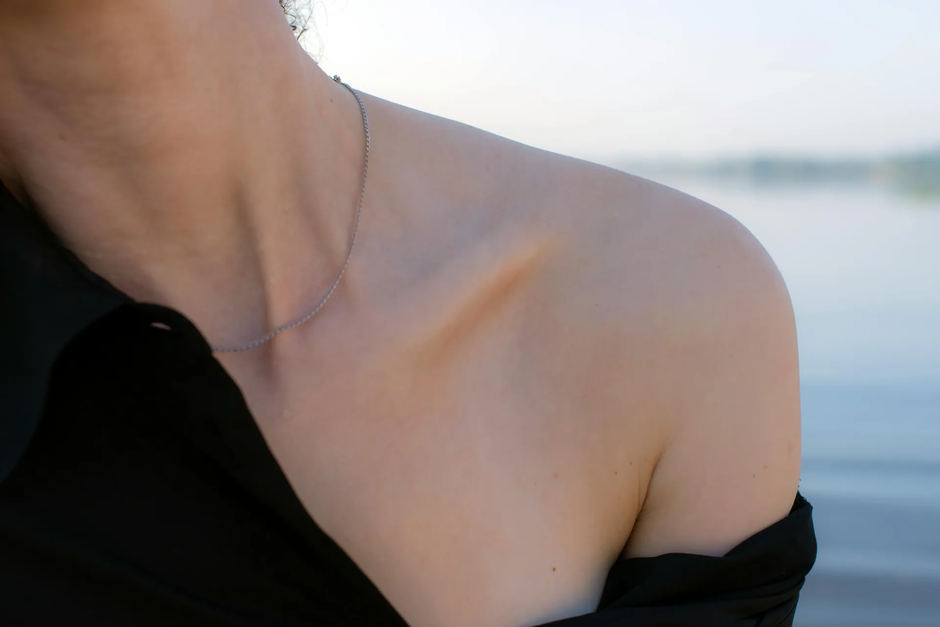 showing shoulder on beach